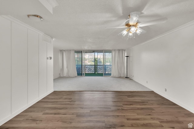 515 S 1000 E Unit 706, Salt Lake City, UT 84102 - spare room featuring a ceiling fan, a textured ceiling, wood finished floors, a wall of windows, and crown molding