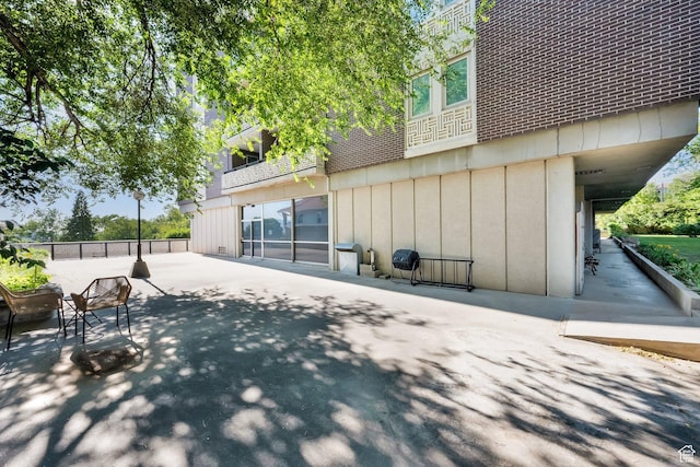 515 S 1000 E Unit 706, Salt Lake City, UT 84102 - back of property featuring a patio and board and batten siding