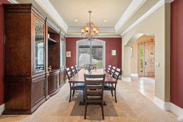 364 N Tanner Ln, Midway, UT 84049 - dining space featuring a chandelier, arched walkways, light carpet, ornamental molding, and a raised ceiling