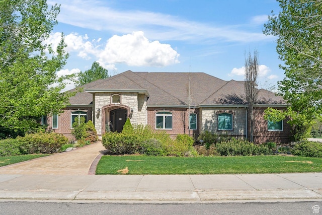 364 N Tanner Ln, Midway, UT 84049 - french country style house featuring stone siding, a front lawn, and brick siding