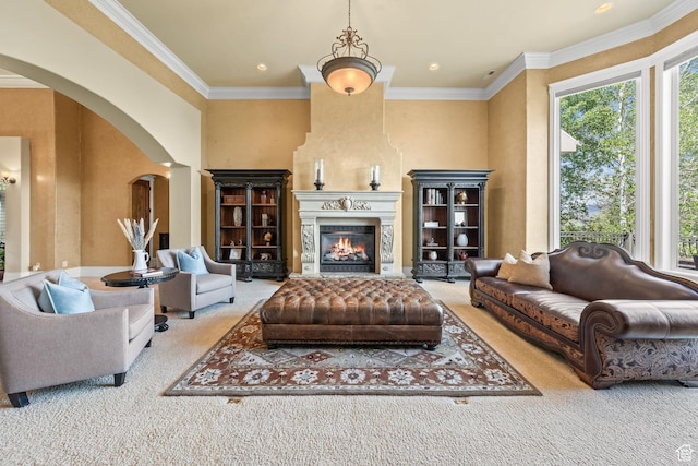 364 N Tanner Ln, Midway, UT 84049 - carpeted living area featuring arched walkways, crown molding, a fireplace, and recessed lighting