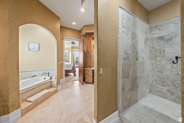 364 N Tanner Ln, Midway, UT 84049 - full bathroom with ensuite bath, a ceiling fan, a garden tub, a textured wall, and tile patterned floors
