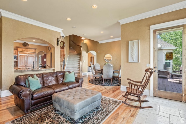 364 N Tanner Ln, Midway, UT 84049 - living area with arched walkways, stairs, crown molding, recessed lighting, and light wood-type flooring