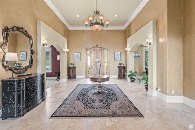 364 N Tanner Ln, Midway, UT 84049 - entryway with arched walkways, ornamental molding, a chandelier, a towering ceiling, and recessed lighting