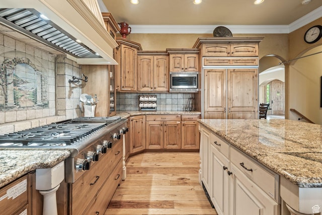 364 N Tanner Ln, Midway, UT 84049 - kitchen featuring appliances with stainless steel finishes, premium range hood, recessed lighting, crown molding, and light wood-style flooring