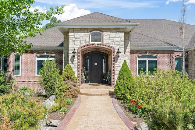 364 N Tanner Ln, Midway, UT 84049 - entrance to property featuring a shingled roof, brick siding, and stone siding