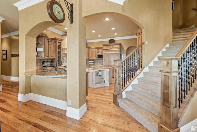 364 N Tanner Ln, Midway, UT 84049 - staircase with ornamental molding, wood-type flooring, arched walkways, and recessed lighting
