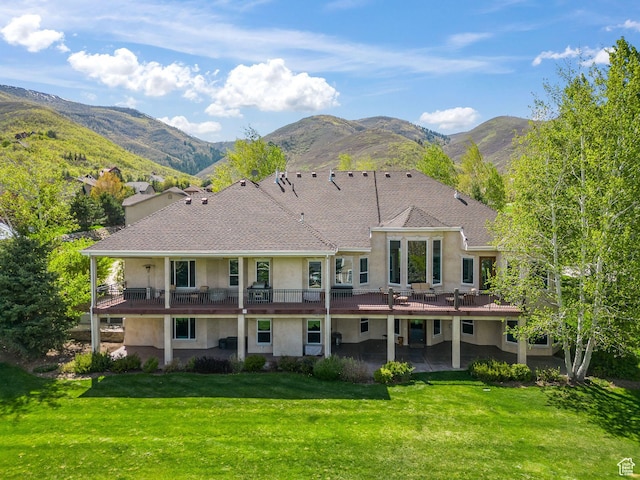 364 N Tanner Ln, Midway, UT 84049 - back of house with stucco siding, a lawn, a patio, and a deck with mountain view
