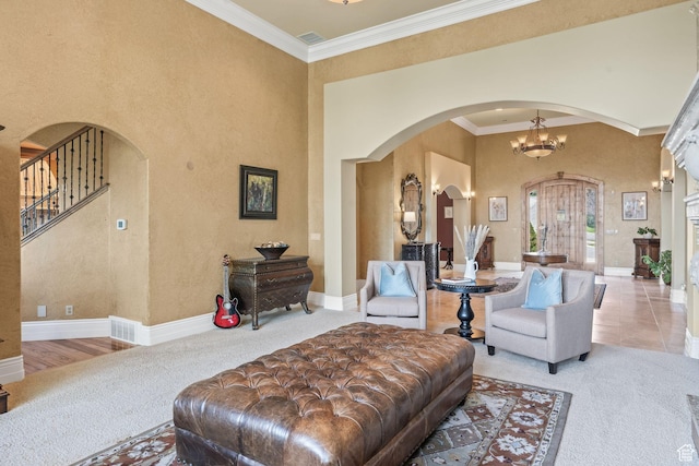 364 N Tanner Ln, Midway, UT 84049 - carpeted living area with arched walkways, crown molding, a high ceiling, and stairs