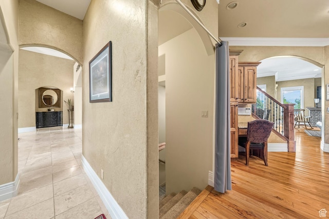 364 N Tanner Ln, Midway, UT 84049 - corridor featuring arched walkways, ornamental molding, a textured wall, and stairs