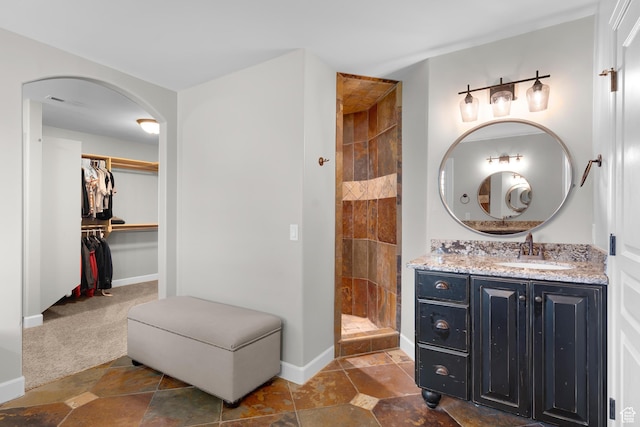 916 Ledgestone Ln, Heber City, UT 84032 - full bath featuring a tile shower, vanity, and a spacious closet