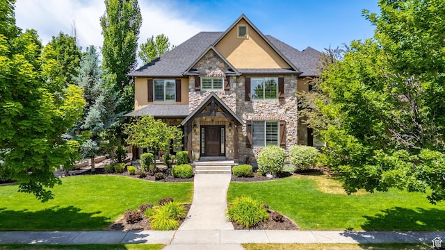 916 Ledgestone Ln, Heber City, UT 84032 - craftsman house featuring stone siding, stucco siding, and a front lawn