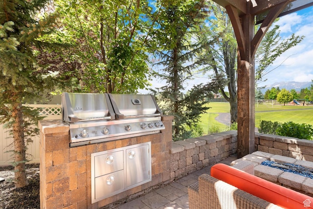 916 Ledgestone Ln, Heber City, UT 84032 - view of patio with an outdoor kitchen and a mountain view