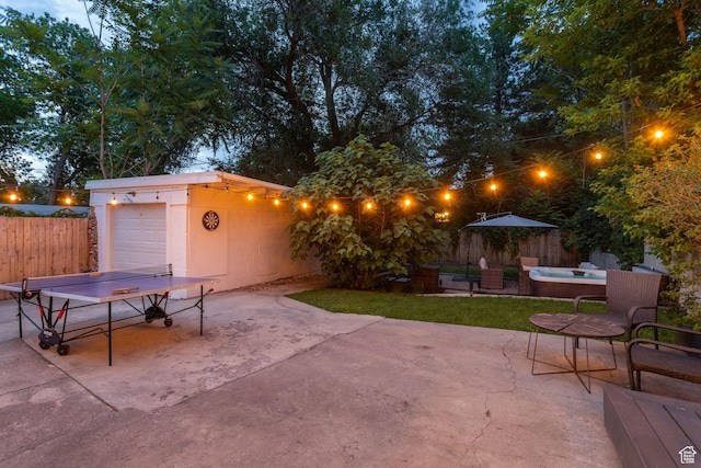 1163 E Blaine Ave, Salt Lake City, UT 84105 - view of patio / terrace featuring concrete driveway, an outdoor hot tub, and outdoor dining area