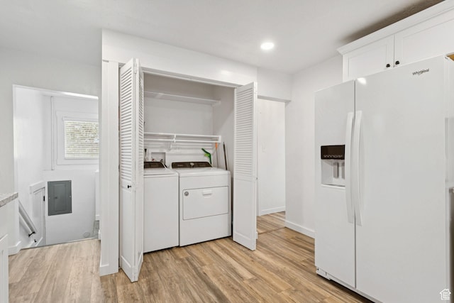 1163 E Blaine Ave, Salt Lake City, UT 84105 - laundry room featuring independent washer and dryer, light wood-type flooring, electric panel, and recessed lighting
