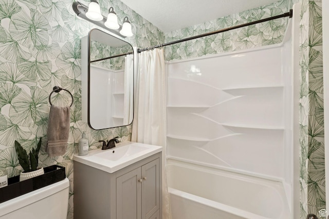 1163 E Blaine Ave, Salt Lake City, UT 84105 - bathroom featuring wallpapered walls, vanity, and shower / bathtub combination with curtain