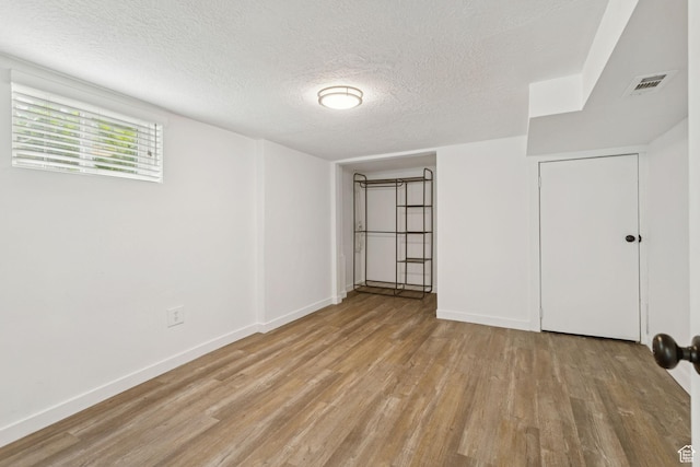 1163 E Blaine Ave, Salt Lake City, UT 84105 - unfurnished bedroom featuring light wood finished floors and a textured ceiling
