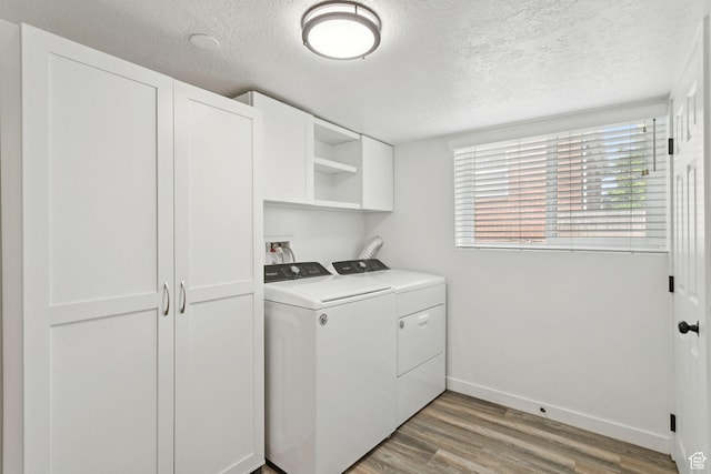 1163 E Blaine Ave, Salt Lake City, UT 84105 - laundry room with a textured ceiling, washing machine and clothes dryer, and light wood finished floors