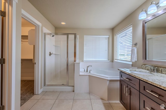 1107 W Coyote Gulch Way, Bluffdale, UT 84065 - full bath with a shower stall, vanity, a walk in closet, and recessed lighting