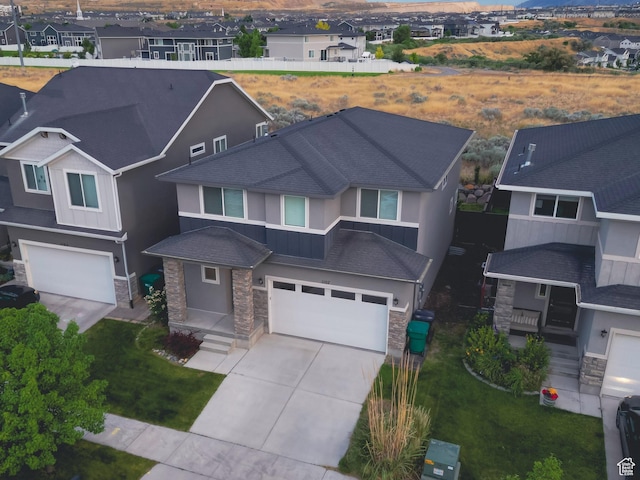 1107 W Coyote Gulch Way, Bluffdale, UT 84065 - view of front of house featuring stone siding, a garage, and a residential view