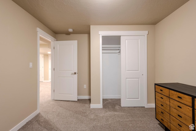 1107 W Coyote Gulch Way, Bluffdale, UT 84065 - unfurnished bedroom featuring carpet, a closet, and a textured ceiling