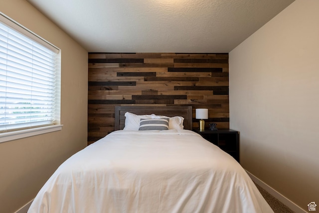 1107 W Coyote Gulch Way, Bluffdale, UT 84065 - carpeted bedroom featuring wooden walls and baseboards