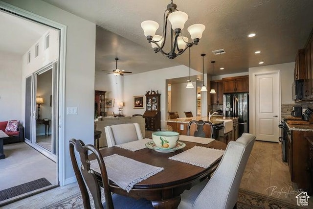 2893 W Nemi Ln, St George, UT 84770 - dining room with a chandelier, a ceiling fan, and recessed lighting