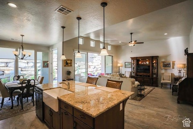 2893 W Nemi Ln, St George, UT 84770 - kitchen with dishwasher, ceiling fan, a chandelier, hanging light fixtures, and light stone countertops