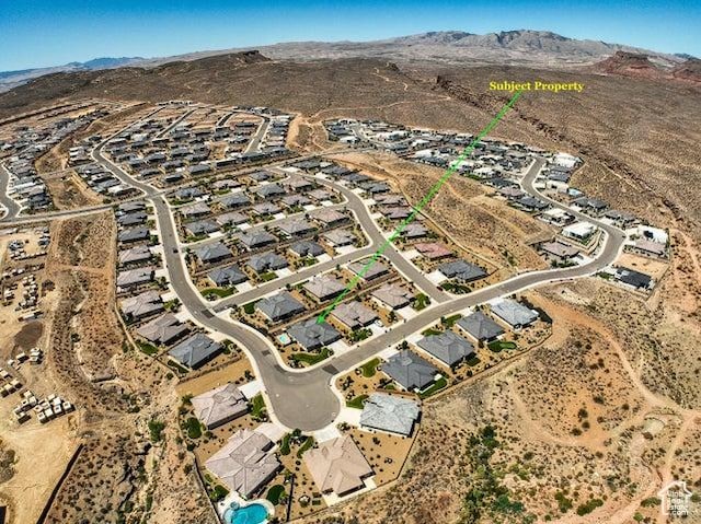 2893 W Nemi Ln, St George, UT 84770 - aerial view of property and surrounding area featuring a mountain backdrop and nearby suburban area