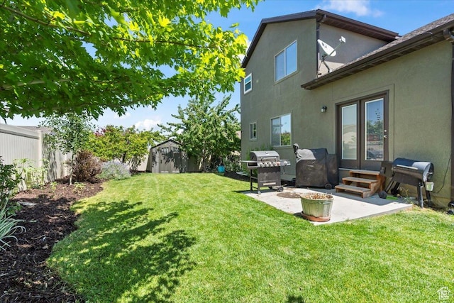 4572 S Rosa Arbor Cir W, West Valley City, UT 84128 - fenced backyard with a patio area, entry steps, and a storage unit