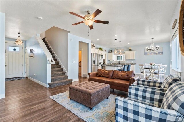 64 W 470 N, Vineyard, UT 84059 - living room with wood finished floors, stairs, a chandelier, ceiling fan, and recessed lighting