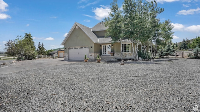 6195 Highland Dr, Park City, UT 84098 - view of front facade with stucco siding, stone siding, concrete driveway, and an attached garage