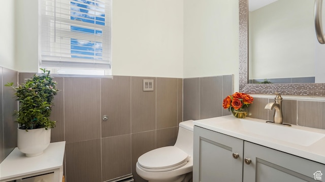 6195 Highland Dr, Park City, UT 84098 - bathroom featuring vanity, tile walls, wainscoting, and backsplash