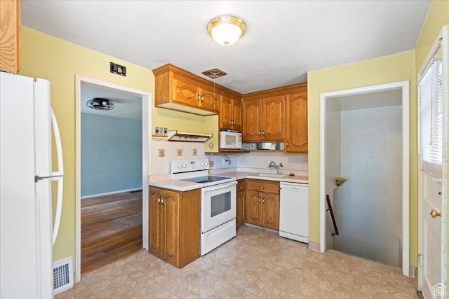 876 N 1300 W, Salt Lake City, UT 84116 - kitchen with white appliances, light countertops, and brown cabinetry