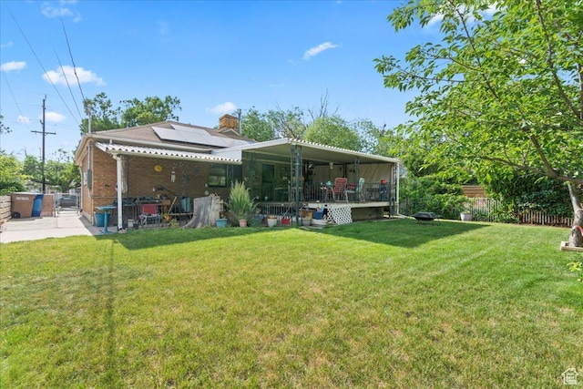876 N 1300 W, Salt Lake City, UT 84116 - back of house featuring solar panels, a patio, and brick siding
