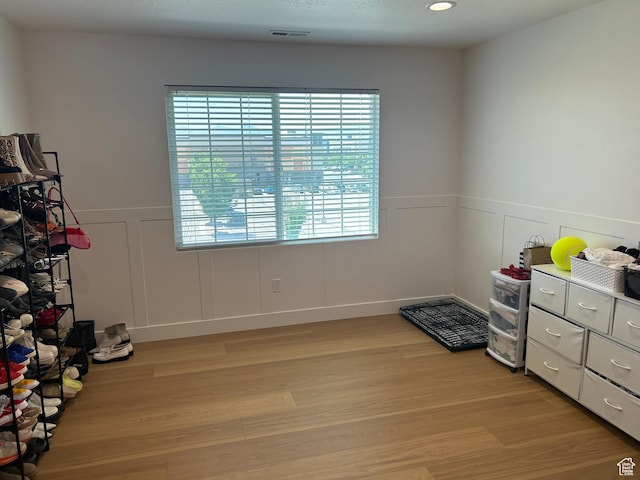164 E Spencer Peak Way S Unit A11, Draper, UT 84020 - interior space with a decorative wall, light wood-type flooring, a wainscoted wall, and recessed lighting