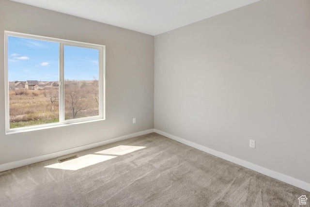 75 N Rio Grand Ave, Farmington, UT 84025 - carpeted empty room with healthy amount of natural light