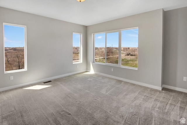 75 N Rio Grand Ave, Farmington, UT 84025 - carpeted empty room with plenty of natural light