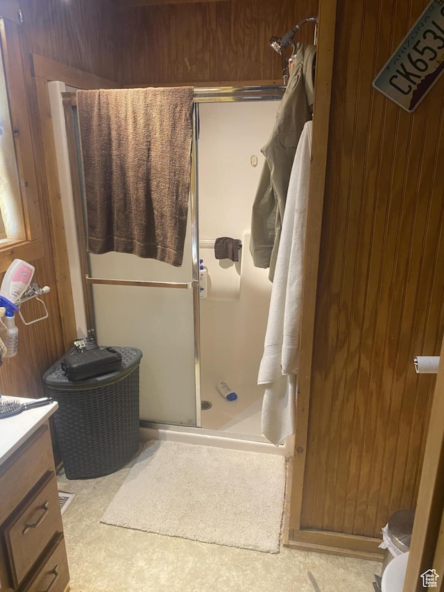 9835 S Big Buck E, Duchesne, UT 84021 - full bathroom with a stall shower, vanity, and wood walls