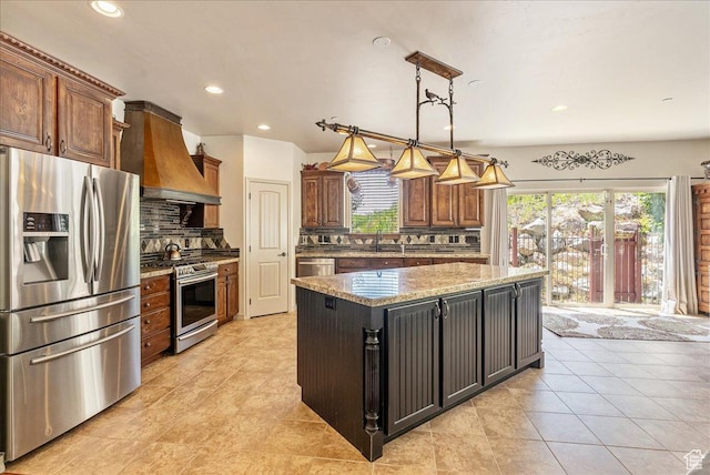 1487 E Deer Ridge Dr, Draper, UT 84020 - kitchen with stainless steel appliances, custom exhaust hood, healthy amount of natural light, tasteful backsplash, and recessed lighting