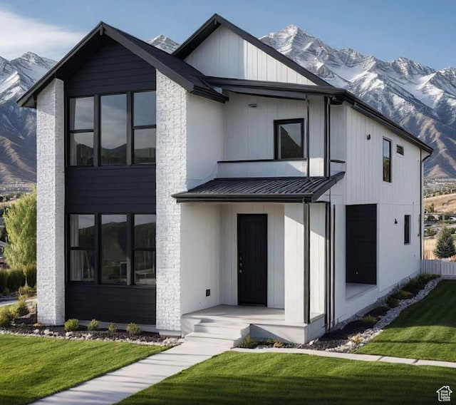 5345 W Tiva Ln Unit 1, Highland, UT 84003 - modern farmhouse style home with a mountain view, a standing seam roof, a front yard, and a metal roof