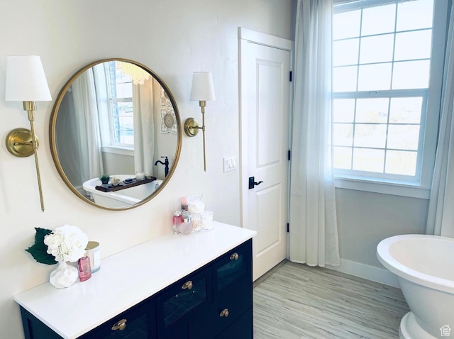 14312 S Herriman View Way, Herriman, UT 84096 - bathroom featuring vanity, a freestanding bath, and wood finished floors