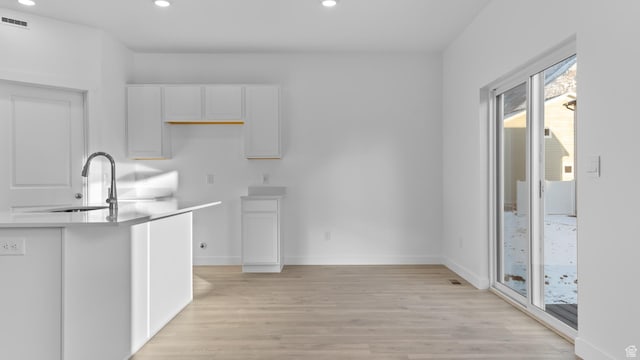 838 N 1860 E Unit 161, Salem, UT 84653 - kitchen with recessed lighting, light wood finished floors, white cabinets, and light countertops