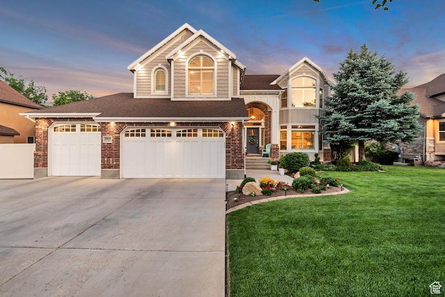 3065 W Current Creek Dr, South Jordan, UT 84095 - view of front facade featuring a yard, concrete driveway, roof with shingles, an attached garage, and stone siding