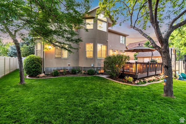 3065 W Current Creek Dr, South Jordan, UT 84095 - rear view of property featuring stucco siding, a wooden deck, and a fenced backyard