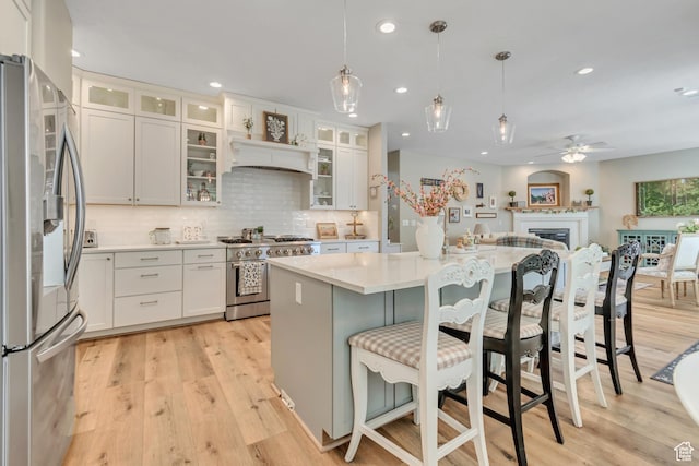 3065 W Current Creek Dr, South Jordan, UT 84095 - kitchen with stainless steel appliances, light wood-style floors, ceiling fan, light countertops, and recessed lighting