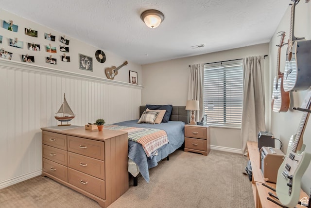 3065 W Current Creek Dr, South Jordan, UT 84095 - bedroom with light colored carpet, a textured ceiling, and wainscoting