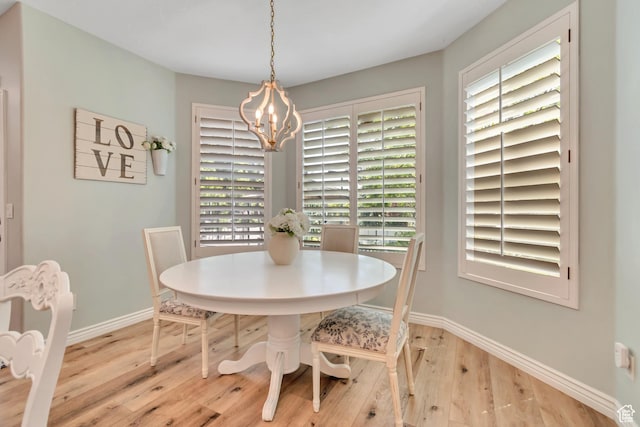 3065 W Current Creek Dr, South Jordan, UT 84095 - dining area with wood finished floors, a chandelier, and healthy amount of natural light