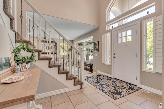 3065 W Current Creek Dr, South Jordan, UT 84095 - entrance foyer featuring stairs, tile patterned floors, and plenty of natural light