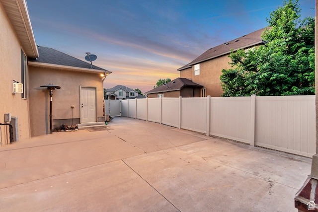 3065 W Current Creek Dr, South Jordan, UT 84095 - patio terrace at dusk featuring a patio and a fenced backyard